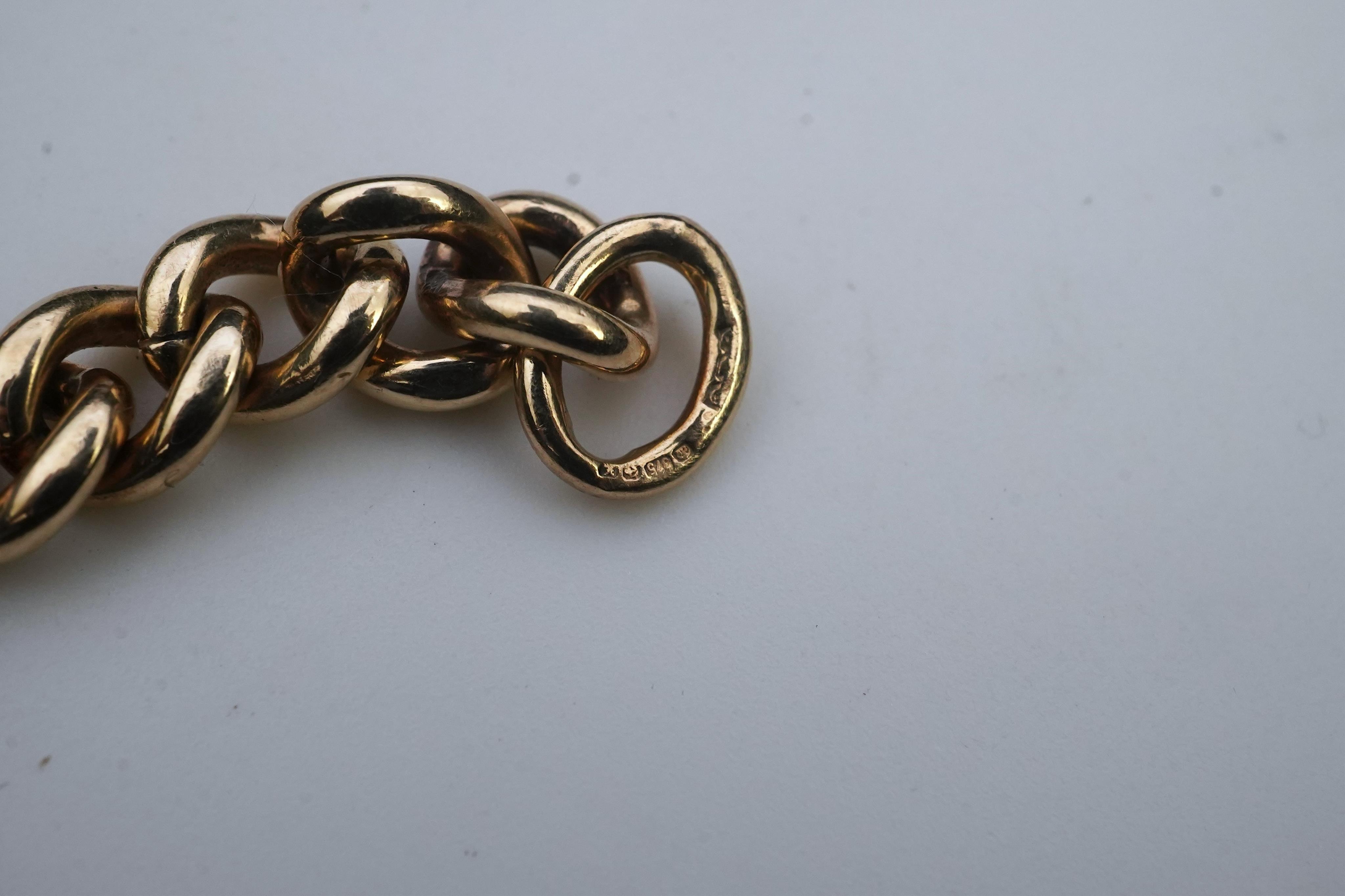 A 9ct gold charm bracelet, circa 1997